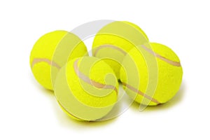 Four tennis balls isolated