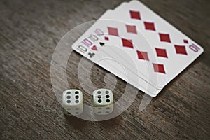 Four tens on a wooden table. concept of gambling and place for your text.