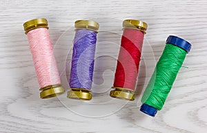 Four Colorful Thread Spools