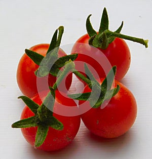 Four tomato isolated on white background.