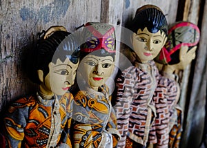Four traditional Javanese Wayang Golek theatre puppets being sold as sourvenirs in Pawon, Java. photo