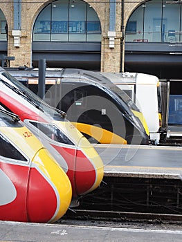 contrasting train profiles at London King's Cross photo