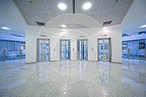 Four transparent elevator door in the business building