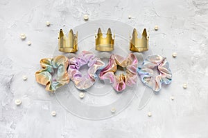 Four trendy scrunchies, golden crowns, pearls