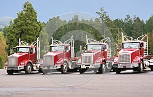 Four trucks in the maintenance yard.