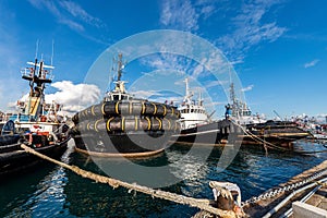 Four tugboats moored in the port of La Spezia Italy