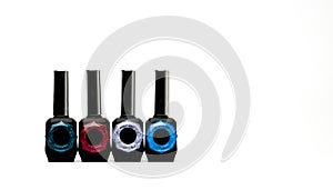 Four unique nail polish bottle isolated on white background with copy space and blank label