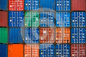 Four vertical rows of shipping containers