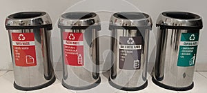 Four Waste Type Metal Dustbins in Row