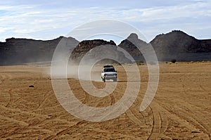 Four-wheel drive jeep on a desert road