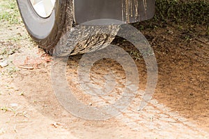 Four wheel drive tire with tracks on dry dirt road