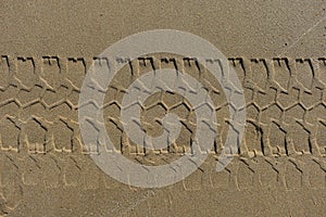 Four wheel drive tracks horizontal texture in sand
