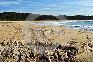 Four wheel drive tyre tracks on a beach