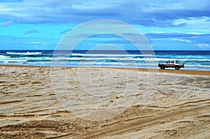 Four wheel drive vehicle on beach at Fraser Island Australia