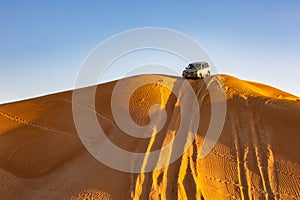 Four wheel drive vehicles in desert safari