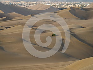 Four wheel drive 4WD 4x4 dune beach buggy motor vehicle tour in sand desert Huacachina Ica Peru South America