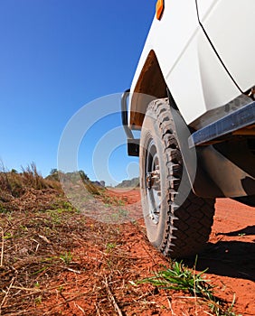Four wheel drive wheel on red dirt road