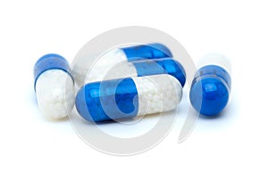 Four white-blue pills photo