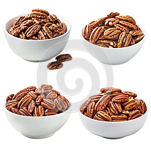 Four White Bowls Filled with Pecan Nuts