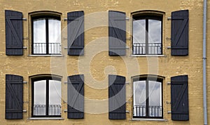 Four windows on the frontage of a house