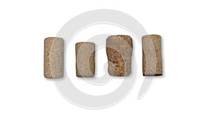 Four wine corks of different sizes and styles isolated on white background