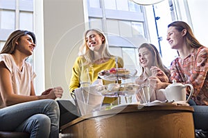 Four women having afternoon tea