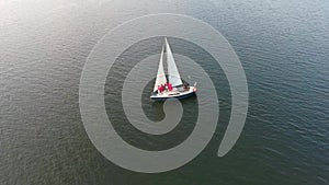 Four women and skipper traveling on sailing boat