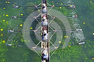 Four Womens rowing team on blue lake