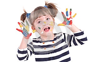 Four-year girl with hands soiled in a paint.