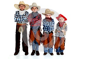 Four young cowboy brothers standing with arms fold
