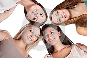 Four young woman looking down