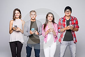 Fours Friends Using gadget Technology phone isolated on grey background