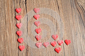 Fourteen made out of sugarcoated heart shape candy photo