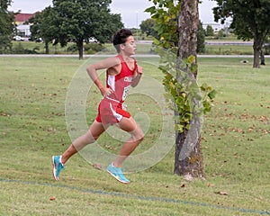 Fourteen year-old Amerasian boy running a cross country race in Oklahoma.