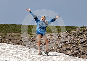 Fourteen year-old Caucasian girl posing enthusiastically in Mount Rainier National Park, Washington