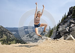 Fourteen year-old Caucasian girl posing in Mount Rainier National Park, Washington