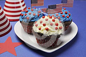 Fourth 4th of July party celebration with red, white and blue chocolate cupcakes closeup.