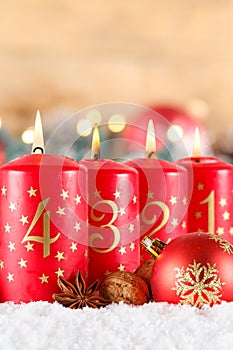 Fourth 4th Sunday in advent with burning candle Christmas time decoration portrait format with copyspace copy space