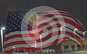 Fourth of July Fireworks display with the American Flag overlay copy space