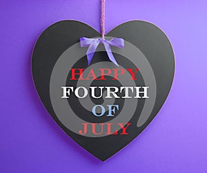 Fourth of July, USA America holiday, celebration message on heart shape blackboard