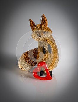 Fox figurine with red glass heart