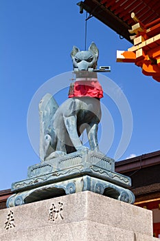 Fox holding a key in its mouth, Fushimi Inari Shrine, Kyoto photo