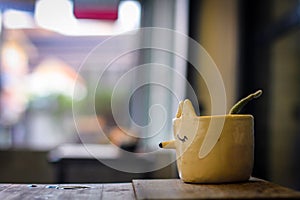 Fox Plant Pot on wooden table ,Background image is bokeh
