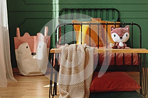 Fox shape like pillow and bag with fox head in elegant bedroom interior