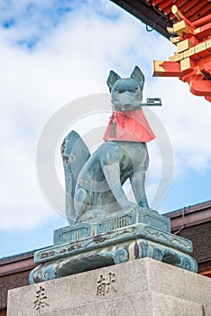 Fox statue at the main gate of Fushimi Inari Shrine. Foxes are thought to be Inari`s messengers.