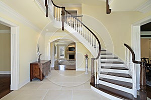 Foyer with curved staircase photo