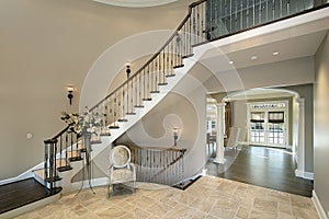 Foyer with curved staircase photo