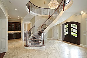 Foyer with curved staircase photo