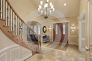 Foyer with curved staircase photo
