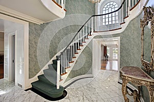 Foyer with green stairs photo